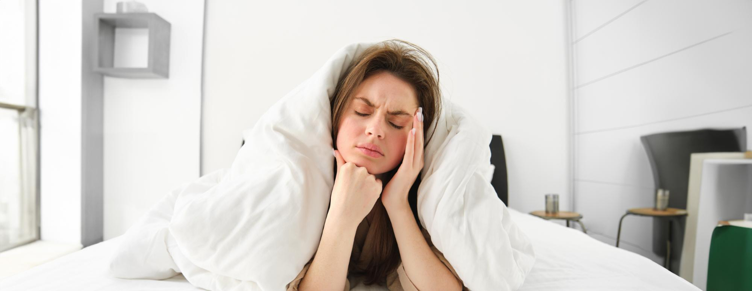 <a href="https://www.freepik.com/free-photo/portrait-woman-rolled-blankets-bed-frowning-feeling-unwell-has-hangover-headache_85939069.htm#fromView=search&page=1&position=1&uuid=2535d884-c62c-45b2-b76c-5bcf53c53ae3&query=bruxism+sleeping+jaw+pain">Image by benzoix on Freepik</a>